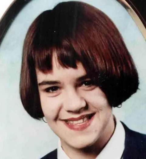 PA Media School picture of Vicky Hamilton. She has brown, short, bobbed hair and is smiling at the camera. She is wearing a school uniform