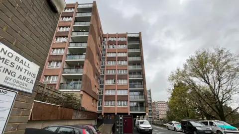 George Carden/BBC Kingfisher Court pictured from the front showing all nine storeys of the 1960s block of flats