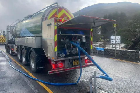 Scottish Water A large tanker adds water to the mains supply via a large blue pipe
