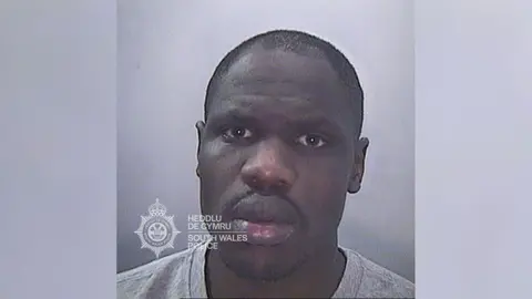 South Wales Police A custody picture of Philip Pariyo