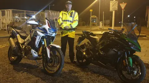 Sgt Craig Winstanley with the recovered motorcycles