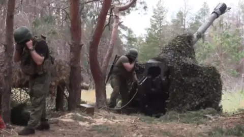 Russian artillerymen target Ukrainian forces near the Dnipro river