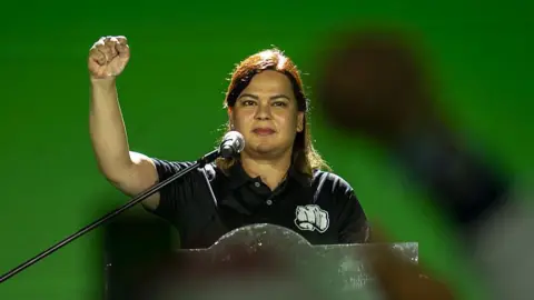 Sara Duterte, Philippines' vice president, raises her fist during a campaign event in Manila, the Philippines