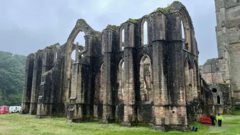 Film crews in the remains of Fountains Abbey