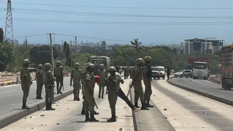 BBC Security officers in uniform on the streets in Dar es Salaam on election day