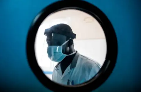 A doctor in Senegal wearing PPE during the coronavirus pandemic.