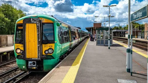 Getty Images A green Southern Railway train pulls into Three Bridges Railway Station