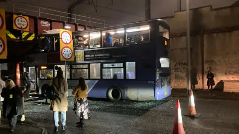 Paul English A first bus wedged under the railway bridge at Cook Street/Commerce Street in Glasgow city centre