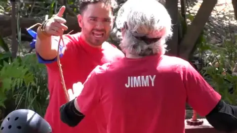 ITV/Shutterstock Adam Thomas angrily pointing at Jimmy Bullard in a still from I'm A Celebrity