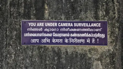 Getty Images 'You are under camera surveillance' sign on a wall in Padmanabhapuram, Tamil Nadu, India on February 12, 2020.