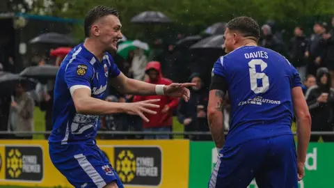 Mael Davies (right) celebrates with Nathan Wood after scoring Penybont's second goal