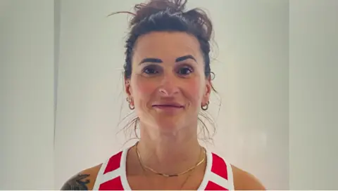 Sabina Falcone-Healey, pictured in a red and white vest, is a member of the England women's over-45 squad