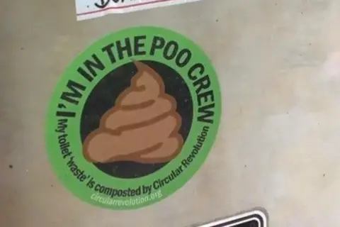 A sticker on the side of a boat with the words 'I'm in the poo crew' written on.