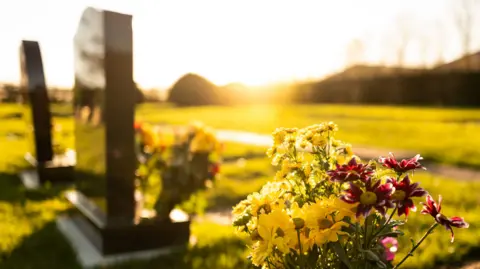 A generic picture of a headstone in a cemetery