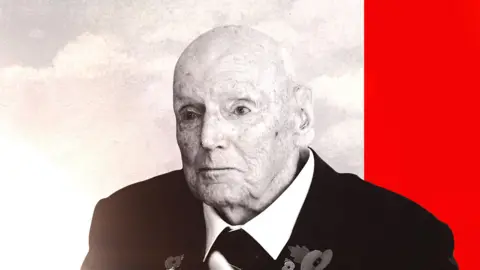 A bald elderly man in a dark jacket looks past the camera