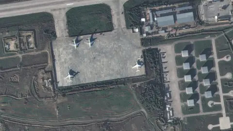 Maxar Technologies A satellite image from Maxar Technologies showing planes on the runway at Hmeimim air base on 15 December