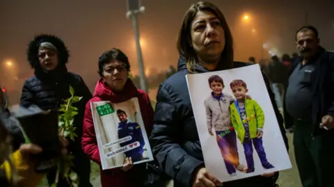 Getty Images People gathered in a march to commoderate their loved ones who lost their lives in the earthquake on February 5, 2024, in Hatay marking the one-year anniversary of the February 2023 earthquake.