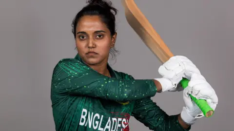  Nigar Sultana Joty poses with a bat