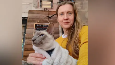 Magda Orpel Magda Orpel sitting in France with Felix the cat