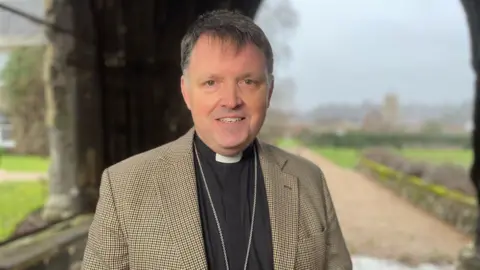 Shaun Whitmore/BBC The Bishop of Norwich, the Right Reverend Graham Usher