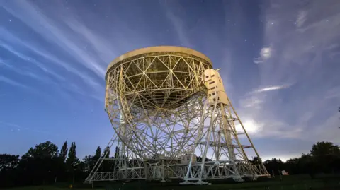 The radio telescope at Jodrell Bank against the sky 