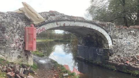 The damaged canal bridge