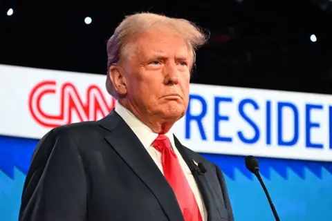 Kyle Mazza/Anadolu via Getty Images Former US President Donald Trump on the debate stage