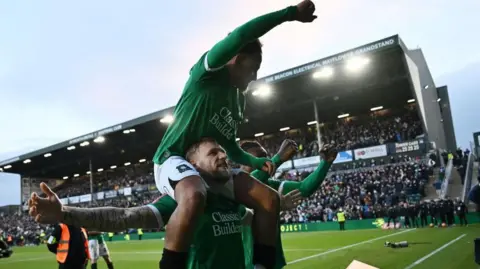 Plymouth Argyle players celebrate their stunning FA Cup fourth round win over Liverpool