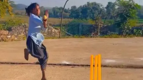 Tendulkar/X Sushila Meena seen bowling on a makeshift cricket pitch