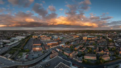 Jakub Pyrdek A picture taken from a drone showing a town below. 