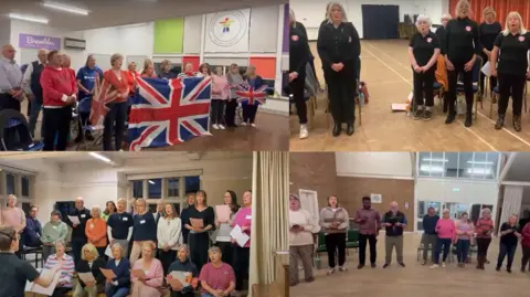 Buskerteers Choir A screen grab of a video which is split in to four quarters with a different choir seen in each one. One group is holding a large union jack and some are holding sheet music and singing.