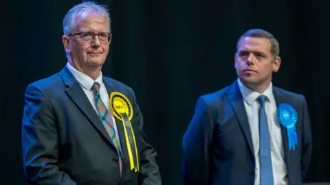 PA Media Seamus Logan and Douglas Ross at the 2024 general election count