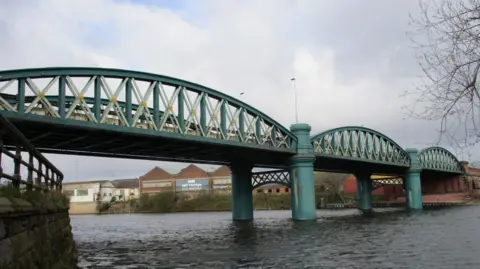 Lady Bay Bridge crossing the River Trent, seen from the river bank