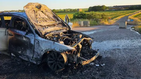 Cambridgeshire Fire and Rescue Service  Burnt out car