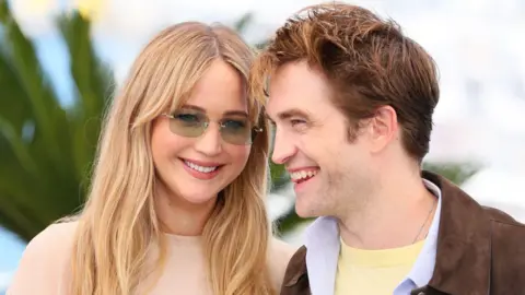 Getty Images Jennifer Lawrence and Robert Pattinson pose during the Die My Love photocall at the 78th annual Cannes Film Festival at Palais des Festivals on May 18, 2025 in Cannes, France.