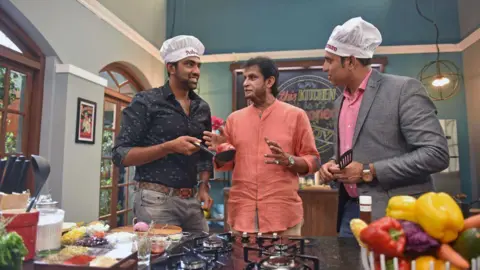 Getty Images Indian Cricketer Ravichandran Ashwin (L), former Indian cricket players Sandeep Patil (C) and VVS Laxman (R) on the set of a food show called Taste Match, a new show on Living Foodz channel, on April 7, 2017 in Mumbai, India