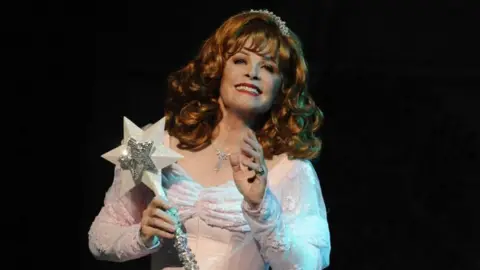 Mayflower Theatre Hollywood actress Stefanie Powers dressed in a white gown holding a wand with a star on the end