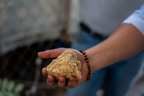 Fritz Pinnow Ricardo Pineda holds the substance of raw soap