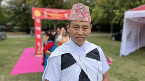 Gyan Gurung, President of the Nepalese Association of Wiltshire, wearing his traditional Nepalese uniform