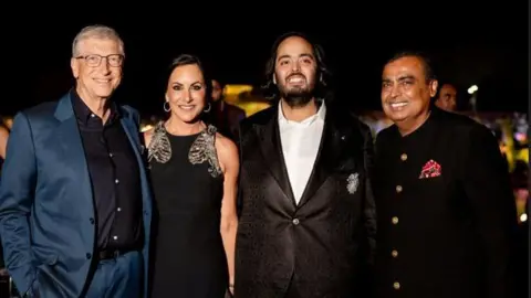 Reuters Bill Gates with his wife Paula Hurd, Anant Ambani and Mukesh Ambani 