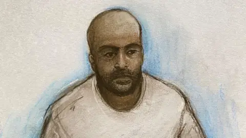 An artist's impression of Hadi Alodid, he has a bald head, black beard and wearing a grey sweatshirt