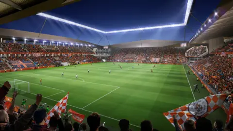 Luton Town FC A CGI image of inside the proposed new Luton ground from a stand behind the goal, looking at the other stands. The stand to the left is two-tier, in front is one-tier and to the right is two-tier. All have fans inside, mostly wearing orange.