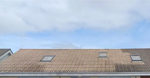 Cornwall Council A photo of a roof which has been partially cleaned