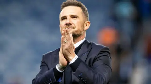 Rangers Interim Head Coach Barry Ferguson applauds fans at full time during a William Hill Premiership match between Rangers and Dundee United at Ibrox Stadium, on May 14, 2025