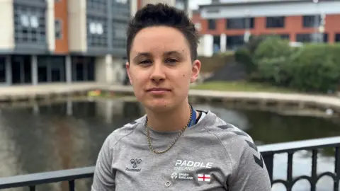 Marathon kayak athlete Freya Peters next to the Nottingham Canal