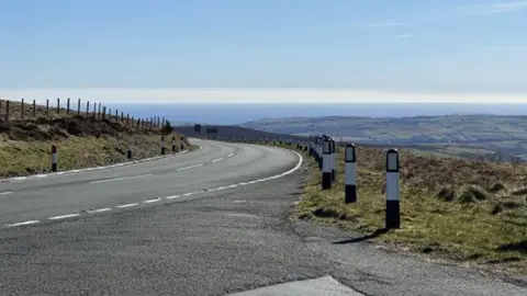 A section of the Mountain Road looking towards Douglas and Onchan with the sea on the horizon.