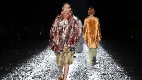Andre Pain, EPA A model presents a creation from the Spring/Summer 2025 Menswear Collection of Belgian fashion Designer Dries Van Noten during Paris Fashion Week