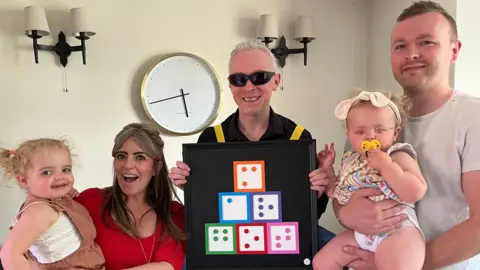 BBC / Naj Modak Artist Clarke Reynolds presents braille artwork to Margot