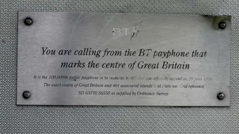 Graham Hogg/Geograph A plaque that says the payphone marks the centre of Great Britain