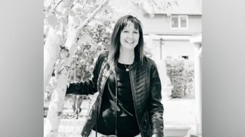 Family A black and white image of a woman in a black leather jacket, with long dark hair